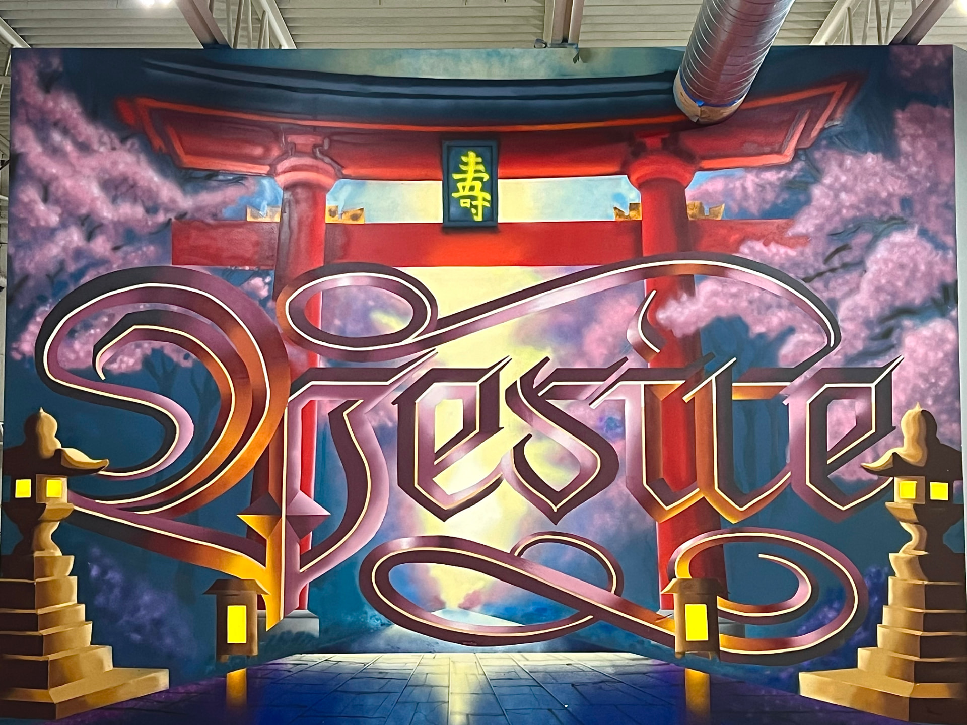 Ornate lettering mural with torii gate and cherry blossoms by The 4th Wall Studio
